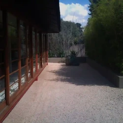 Japanese garden, Japanese architecture, large rock, raked gravel, dry Zen garden.