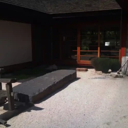 Centre courtyard (tsuboniwa) Japanese Zen garden, large granite block, dry raked gravel.