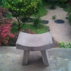 Single seater meditation bench overlooking sunken Japanese stroll / meditation garden.