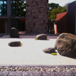 Raised Japanese dry raked Zen garden, gravel, rocks, mosses.